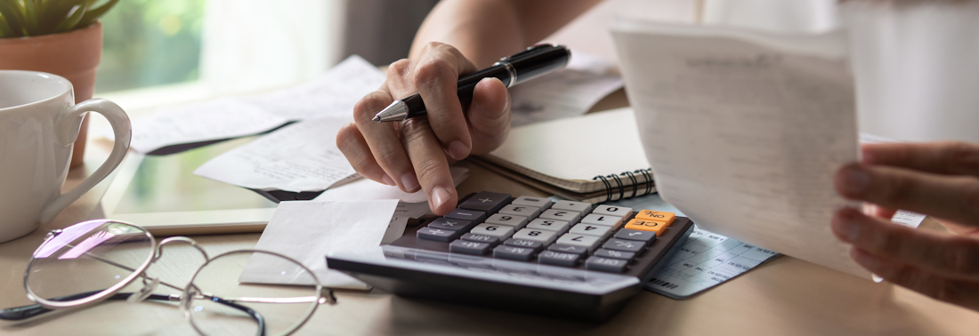 budgeting with receipts and a calculator