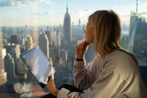 Expat woman browsing websites on a tablet